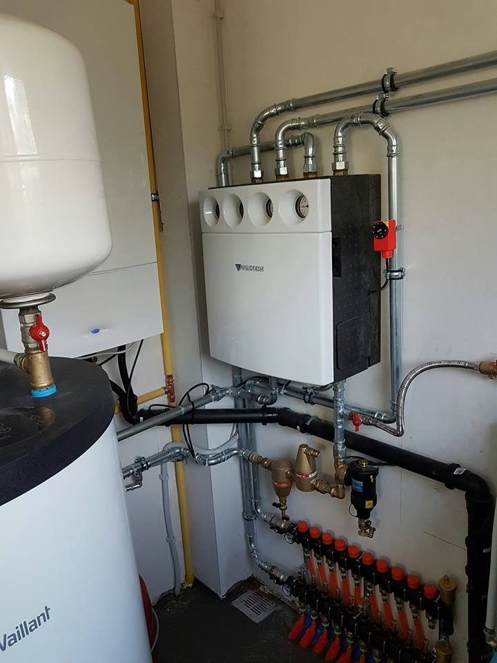 Chaudière Junkers alimentant un boiler de 200 l, un chauffage par le sol et un circuit de radiateurs